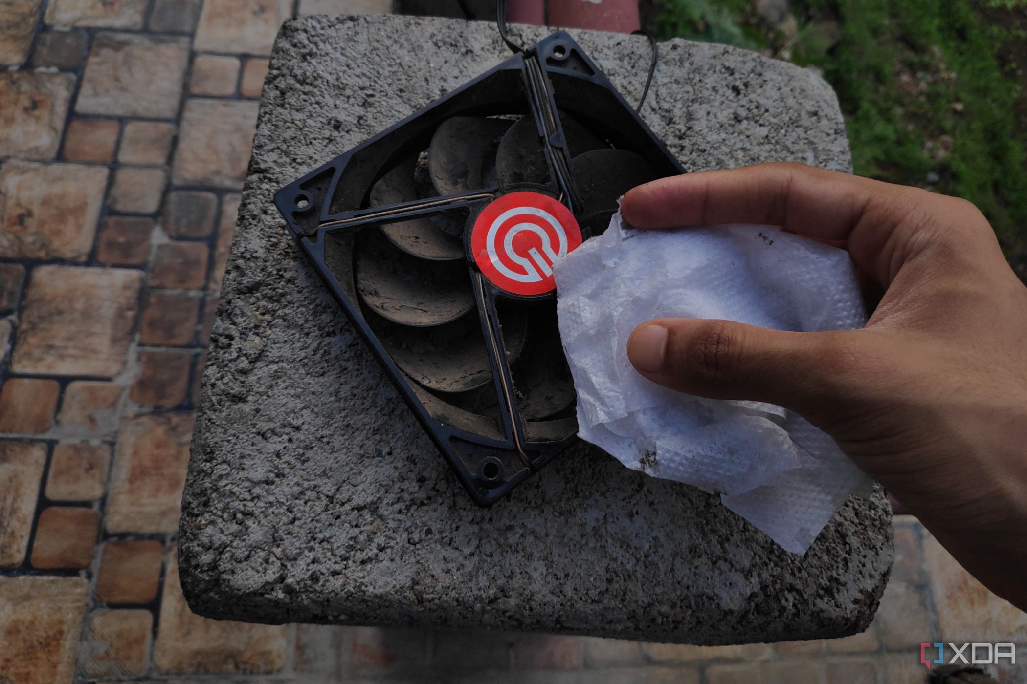 An alcohol wipe and a detached cabinet fan