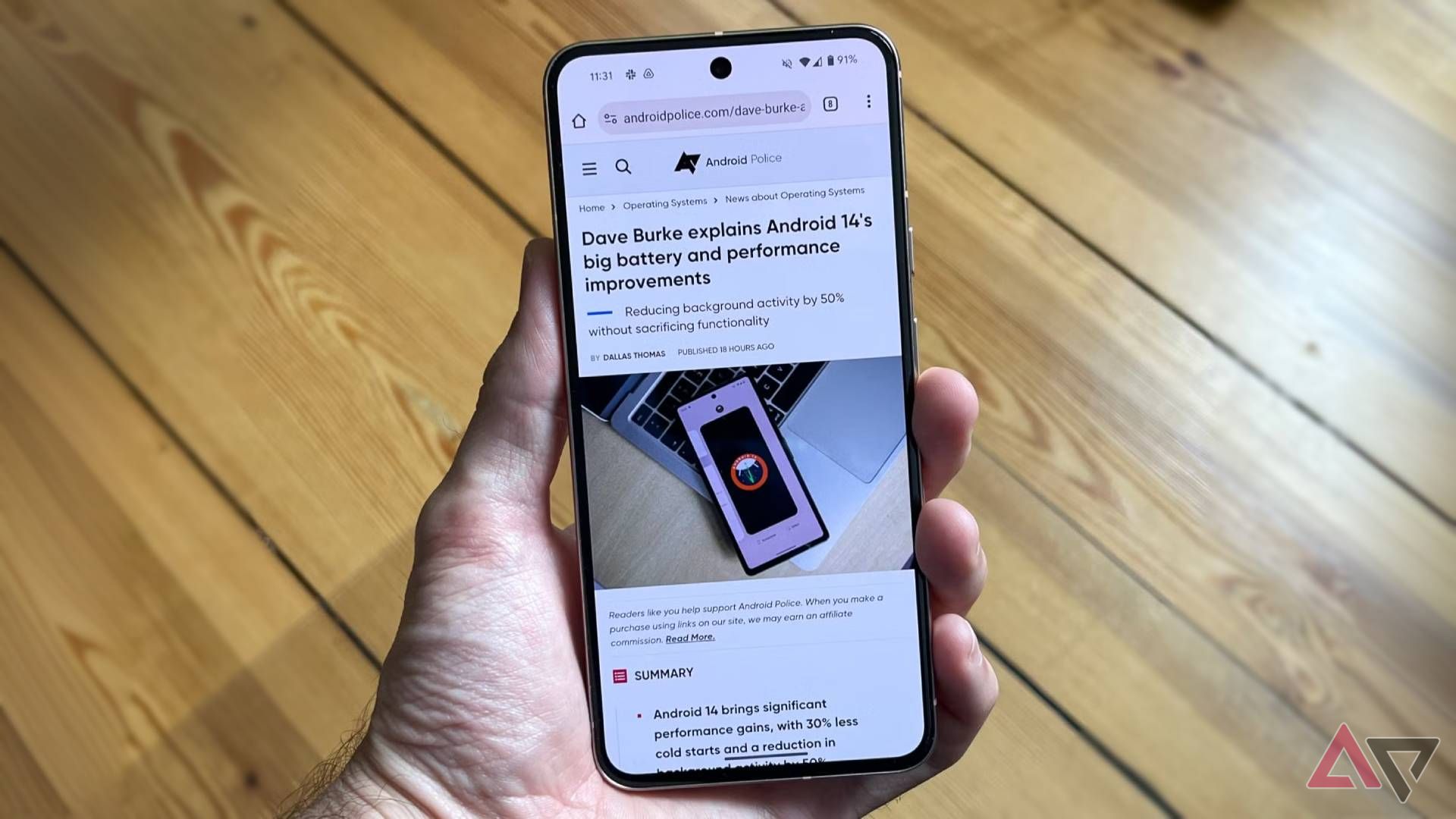 Chrome displayed on a Pixel 8 held in a hand with a wood background.